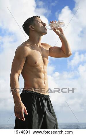 Hawaii, Oahu, Fit Male Drinking Water At The Tidepool. View Large Photo Image Stock Image - Hawaii, Oahu, Fit Male Drinking Water At The Tidepool.. Fotosearch
