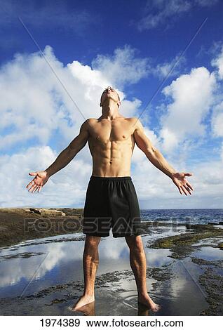 Hawaii, Oahu, Fit Male Posing At The Tidepool. View Large Photo Image Stock Photo - Hawaii, Oahu, Fit Male Posing At The Tidepool.. Fotosearch