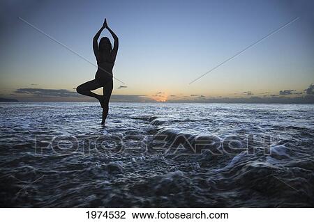 Hawaii, Oahu, Fit Young Girl On The Beach Doing Yoga On The Rocky Coastline. View Large Photo Image Stock Image - Hawaii, Oahu, Fit Young Girl On The Beach Doing Yoga On The Rocky Coastline.. Fotosearch
