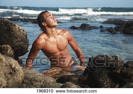 Hawaii, Oahu, Fit Young Male Enjoying A Warm Day In A Tidepool. View Large Photo Image Stock Image - Hawaii, Oahu, Fit Young Male Enjoying A Warm Day In A Tidepool.. Fotosearch