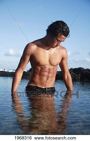 Hawaii, Oahu, Fit Young Male Enjoying A Warm Day In A Tidepool. View Large Photo Image Stock Photograph - Hawaii, Oahu, Fit Young Male Enjoying A Warm Day In A Tidepool.. Fotosearch