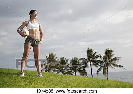 Hawaii, Oahu, Fit Young Woman Holding A Volleyball. View Large Photo Image Stock Photo - Hawaii, Oahu, Fit Young Woman Holding A Volleyball.. Fotosearch