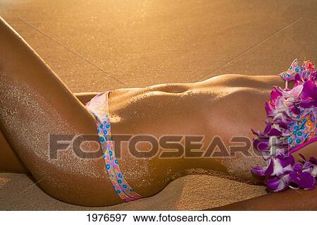 Hawaii, Oahu, Girl On Beach In Swimsuit, Close-Up On Midriff. View Large Photo Image Stock Photo - Hawaii, Oahu, Girl On Beach In Swimsuit, Close-Up On Midriff.. Fotosearch