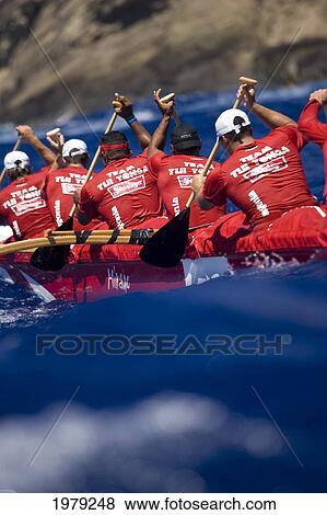 Stock Photo - Hawaii, Oahu, Hawaii Kai, Outrigger Canoe Team Paddling Hard Through Blue Ocean.. Fotosearch