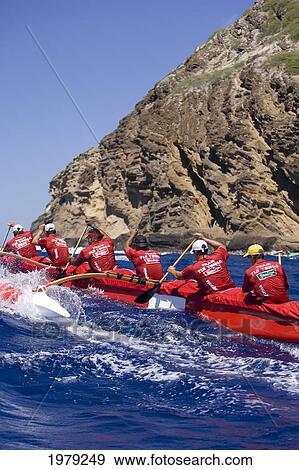 Stock Photo - Hawaii, Oahu, Hawaii Kai, Outrigger Canoe Team Paddling Hard Through Blue Ocean.. Fotosearch