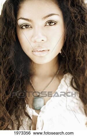 Hawaii, Oahu, Headshot Of A Young Woman In A White Top (Muted Colored Photo). View Large Photo Image Stock Photograph - Hawaii, Oahu, Headshot Of A Young Woman In A White Top (Muted Colored Photo).. Fotosearch