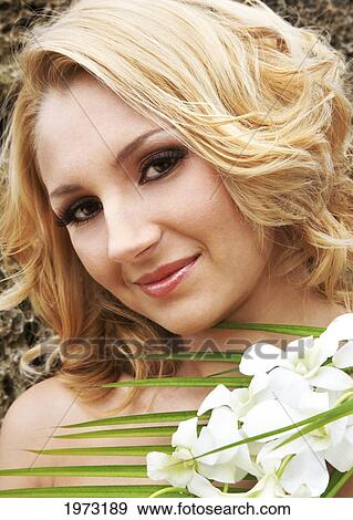 Stock Photo - Hawaii, Oahu, Headshot Of Attractive Woman With Flowers.. Fotosearch