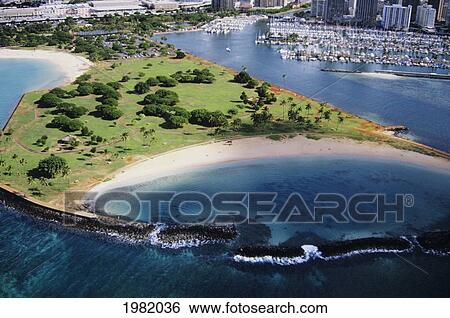 Stock Photograph - Hawaii, Oahu, Honolulu, Aerial of Magic Island. Fotosearch