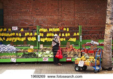 Stock Photo - Hawaii, Oahu, Honolulu, Chinatown, Bunches Of Hanging Bananas And Nemour Produce For Sale/N.. Fotosearch