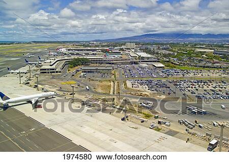 Stock Image - Hawaii, Oahu, Honolulu, Honolulu International Airport, Aerial Of Airplanes Parked At Terminal.. Fotosearch