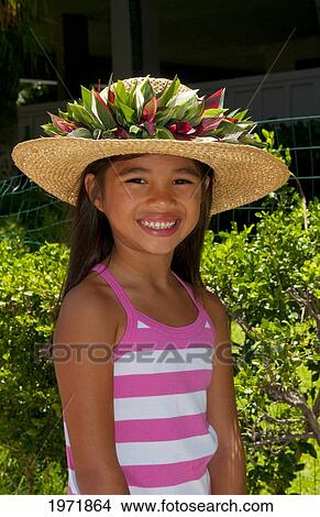 Hawaii, Oahu, Honolulu, Local Young Girl Models A Straw Hat In Her Portrait. View Large Photo Image Picture - Hawaii, Oahu, Honolulu, Local Young Girl Models A Straw Hat In Her Portrait.. Fotosearch