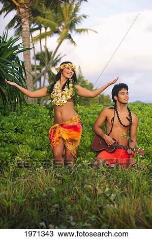 Hawaii, Oahu, Hula Dancer Couple In Tropical Setting. View Large Photo Image Stock Image - Hawaii, Oahu, Hula Dancer Couple In Tropical Setting.. Fotosearch