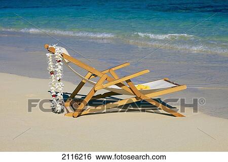 Hawaii, Oahu, Kailua, A lounge chair on the white sandy beach of Lanikai. View Large Photo Image Stock Photograph - Hawaii, Oahu, Kailua, A lounge chair on the white sandy beach of Lanikai.. Fotosearch