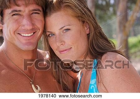 Stock Image - Hawaii, Oahu, Kailua Beach, Portrait Of A Happy Couple.. Fotosearch