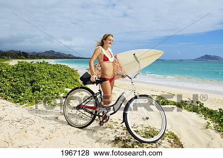 Stock Photo - Hawaii, Oahu, Kailua Beach, Teenage Girl With Surboard And Bike.. Fotosearch