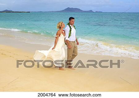 Picture - Hawaii, Oahu, Kailua, Lanikai Beach, Attractive Newlywed Couple Walking Along Beach.. Fotosearch