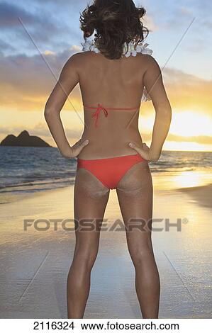 Hawaii, Oahu, Kailua, Lanikai, Young woman posing on beach. View Large Photo Image Picture - Hawaii, Oahu, Kailua, Lanikai, Young woman posing on beach.. Fotosearch