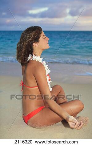 Hawaii, Oahu, Kailua, Lanikai, Young woman meditating on beach. View Large Photo Image Stock Image - Hawaii, Oahu, Kailua, Lanikai, Young woman meditating on beach.. Fotosearch