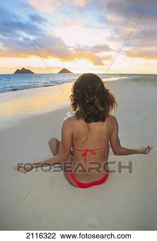 Hawaii, Oahu, Kailua, Lanikai, Young woman meditating on beach. View Large Photo Image Stock Image - Hawaii, Oahu, Kailua, Lanikai, Young woman meditating on beach.. Fotosearch