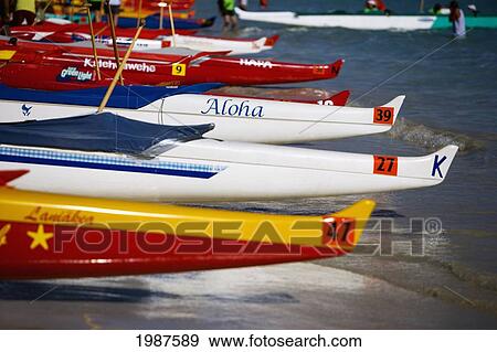 Hawaii, Oahu, Kailua, Lineup Of Colorful Outrigger Canoes On The Shoreline At A Canoe Race View Large Photo Image Stock Photo - Hawaii, Oahu, Kailua, Lineup Of Colorful Outrigger Canoes On The Shoreline At A Canoe Race. Fotosearch