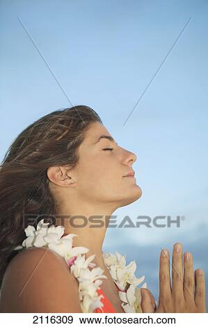 Hawaii, Oahu, Kailua, Young woman praying on the beach View Large Photo Image Stock Photo - Hawaii, Oahu, Kailua, Young woman praying on the beach. Fotosearch