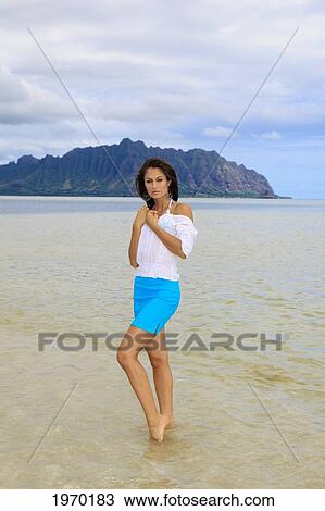 Stock Image - Hawaii, Oahu, Kaneohe Bay, Beautiful Woman On Sandbar. Fotosearch