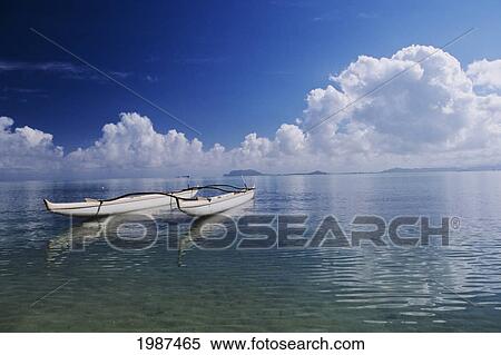 Hawaii, Oahu, Kaneohe Bay, Secret Island, White Double Hull Canoe On Calm Ocean, Blue Sky. View Large Photo Image Stock Photography - Hawaii, Oahu, Kaneohe Bay, Secret Island, White Double Hull Canoe On Calm Ocean, Blue Sky.. Fotosearch