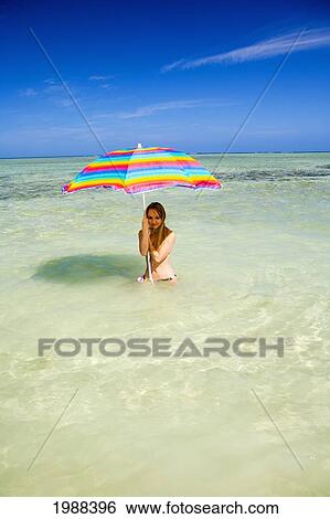 Hawaii, Oahu, Kaneohe, Woman Under A Brightly Colored Umbrella In Crystal Clear Water At The Sandbar Or Dissapearing Island View Large Photo Image Stock Photograph - Hawaii, Oahu, Kaneohe, Woman Under A Brightly Colored Umbrella In Crystal Clear Water At The Sandbar Or Dissapearing Island. Fotosearch