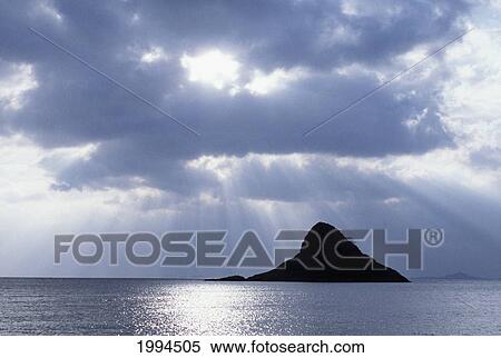 Hawaii, Oahu, Kualoa, Mokoli'i Island (Chinaman's Hat), Sunbeams Coming Down From Storm Clouds View Large Photo Image Stock Photography - Hawaii, Oahu, Kualoa, Mokoli'i Island (Chinaman's Hat), Sunbeams Coming Down From Storm Clouds. Fotosearch