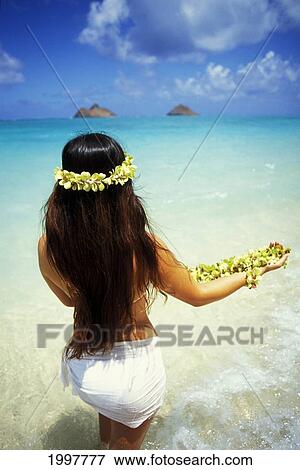 Hawaii, Oahu, Lanikai, Back Of Local Woman With Leis (Standing In Shallow Water) Facing Ocean. View Large Photo Image Stock Photo - Hawaii, Oahu, Lanikai, Back Of Local Woman With Leis (Standing In Shallow Water) Facing Ocean.. Fotosearch