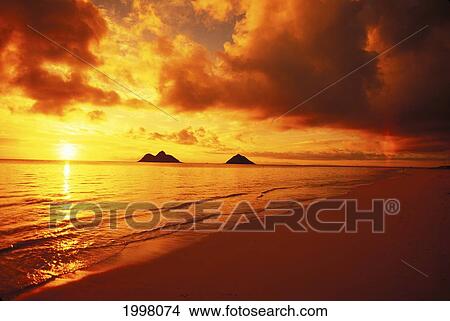 Picture - Hawaii, Oahu, Lanikai Beach At Sunrise Orange Sky With Reflections, Mokulua Islands. Fotosearch