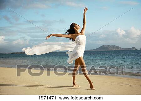 Hawaii, Oahu, Lanikai Beach, Beautiful Female Ballet Dancer On Beach Wearing White Flowing Fabric. View Large Photo Image Stock Image - Hawaii, Oahu, Lanikai Beach, Beautiful Female Ballet Dancer On Beach Wearing White Flowing Fabric.. Fotosearch