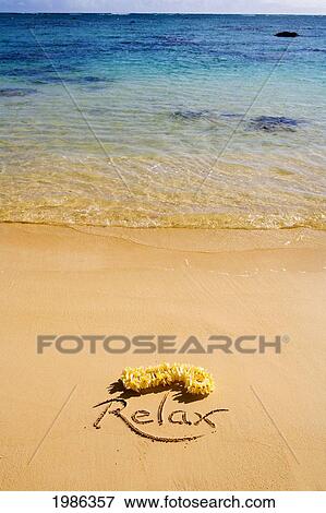 Stock Photo - Hawaii, Oahu, Lanikai Beach Relax Written In The Sand With Yellow Plumeria Lei, Turquoise Ocean. Fotosearch