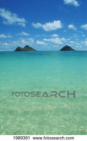 Stock Image - Hawaii, Oahu, Lanikai Beach, View Of Water, Sky, Clouds And Mokulua Islands. Fotosearch