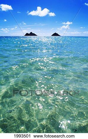 Stock Image - Hawaii, Oahu, Lanikai Beach, View Of Water, Sky, Clouds And Mokulua Islands. Fotosearch