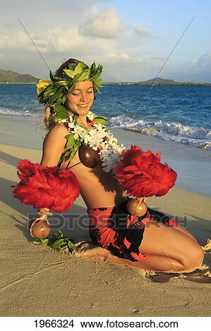 Hawaii, Oahu, Lanikai Beach, Young Woman Dancing Hula Along Sandy Shore With Uli'uli. View Large Photo Image Picture - Hawaii, Oahu, Lanikai Beach, Young Woman Dancing Hula Along Sandy Shore With Uli'uli.. Fotosearch