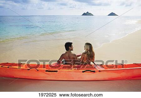 Hawaii, Oahu, Lanikai Beach, Young Couple Sitting Along Shoreline With Kayak. View Large Photo Image Stock Photography - Hawaii, Oahu, Lanikai Beach, Young Couple Sitting Along Shoreline With Kayak.. Fotosearch