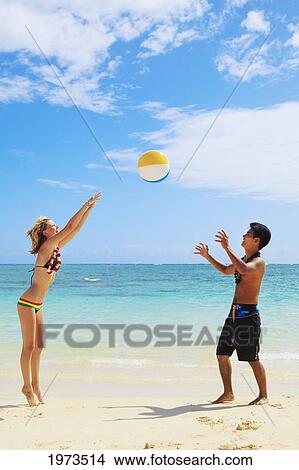 Picture - Hawaii, Oahu, Lanikai Beautiful Couple On The Beach Playing Together.. Fotosearch