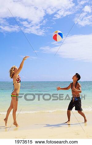 Hawaii, Oahu, Lanikai Beautiful Couple On The Beach Playing Together. View Large Photo Image Stock Photography - Hawaii, Oahu, Lanikai Beautiful Couple On The Beach Playing Together.. Fotosearch