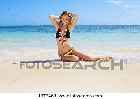 Hawaii, Oahu, Lanikai, Beautiful Girl Enjoying A Day Out While Wearing A Lei. View Large Photo Image Stock Photo - Hawaii, Oahu, Lanikai, Beautiful Girl Enjoying A Day Out While Wearing A Lei.. Fotosearch
