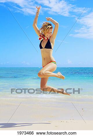 Hawaii, Oahu, Lanikai, Beautiful Girl Enjoying A Day Out While Wearing A Lei. View Large Photo Image Stock Photograph - Hawaii, Oahu, Lanikai, Beautiful Girl Enjoying A Day Out While Wearing A Lei.. Fotosearch
