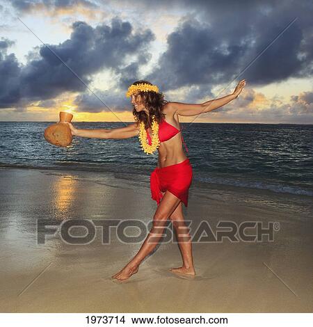 Picture - Hawaii, Oahu, Lanikai, Beautiful Hawaiian Woman Dancing Hula On Ocean Shoreline.. Fotosearch