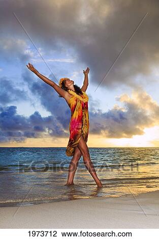 Hawaii, Oahu, Lanikai, Beautiful Hawaiian Woman Dancing Hula On Ocean Shoreline. View Large Photo Image Stock Image - Hawaii, Oahu, Lanikai, Beautiful Hawaiian Woman Dancing Hula On Ocean Shoreline.. Fotosearch