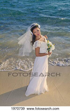 Stock Photo - Hawaii, Oahu, Lanikai, Beautiful Brunette Woman On Her Wedding Day.. Fotosearch