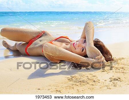 Stock Image - Hawaii, Oahu, Lanikai, Beautiful Woman On The Beach.. Fotosearch