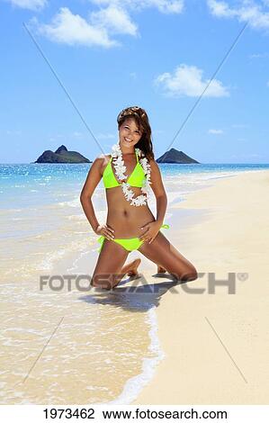 Stock Image - Hawaii, Oahu, Lanikai, Beautiful Woman On The Beach.. Fotosearch