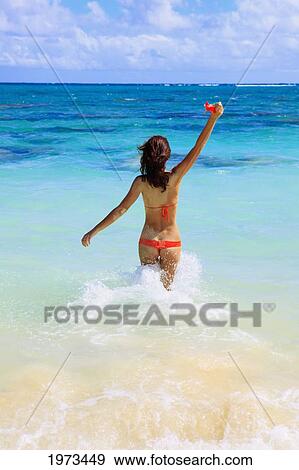 Hawaii, Oahu, Lanikai, Bikini-Clad Girl Walking On Beach, View From Behind. View Large Photo Image Stock Photo - Hawaii, Oahu, Lanikai, Bikini-Clad Girl Walking On Beach, View From Behind.. Fotosearch