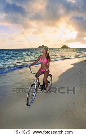 Hawaii, Oahu, Lanikai, Blond Girl Riding Bike Along Beach. View Large Photo Image Stock Photo - Hawaii, Oahu, Lanikai, Blond Girl Riding Bike Along Beach.. Fotosearch