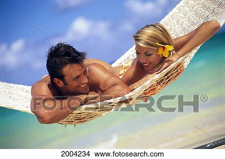 Hawaii, Oahu, Lanikai, Couple Lay In Hammock Together, Smiling Have Fun Ocean Shoreline Background View Large Photo Image Picture - Hawaii, Oahu, Lanikai, Couple Lay In Hammock Together, Smiling Have Fun Ocean Shoreline Background. Fotosearch