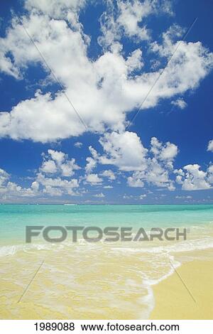 Stock Photo - Hawaii, Oahu, Lanikai; Gentle Wave Washing Ashore On Beach, Turquoise Water And Blue Sky.. Fotosearch